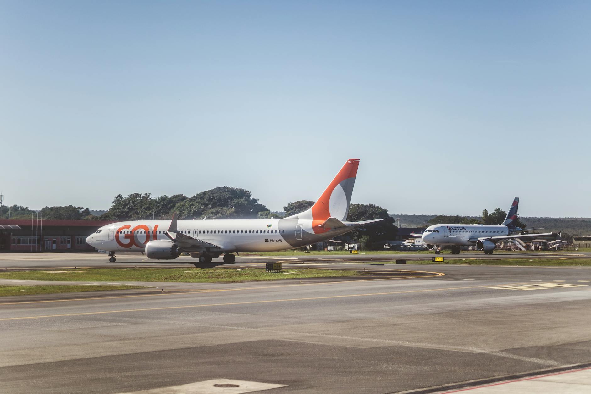 a group of airplanes sitting on the tarmac